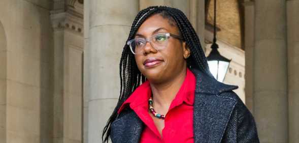 Kemi Badenoch in red shirt