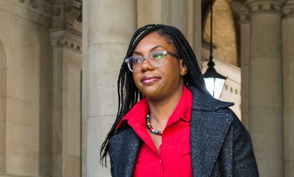 Kemi Badenoch in red shirt