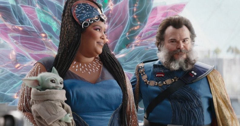 Lizzo (left) with Baby Yoda / Grogu as The Duchess and Jack Black as Captain as Captain Bombadier in The Mandalorian season three episode six "Chapter 22: Guns For Hire"
