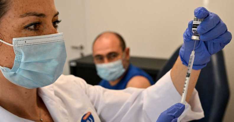 Nurse fills a syringe with the mpox vaccination