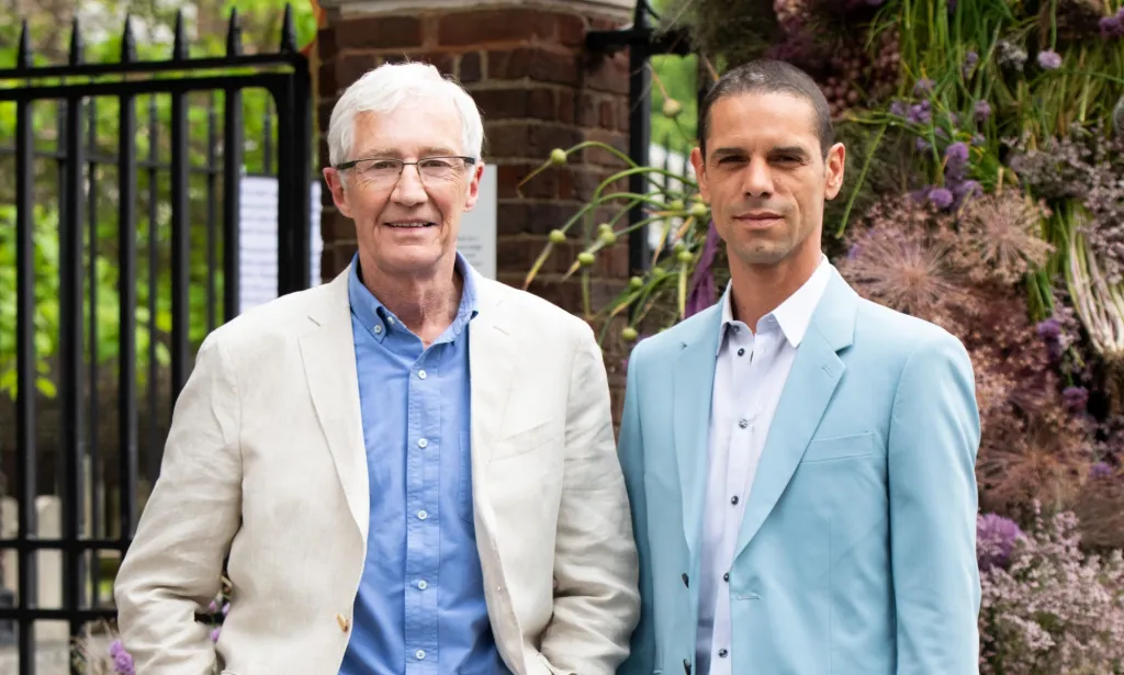 Paul O'Grady with husband Andre Portasio who has revealed funeral details.