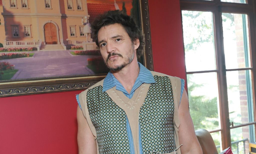 Pedro Pascal wears a spotted green, white and blue vest at the Merge Mansion Mobile Game Event.