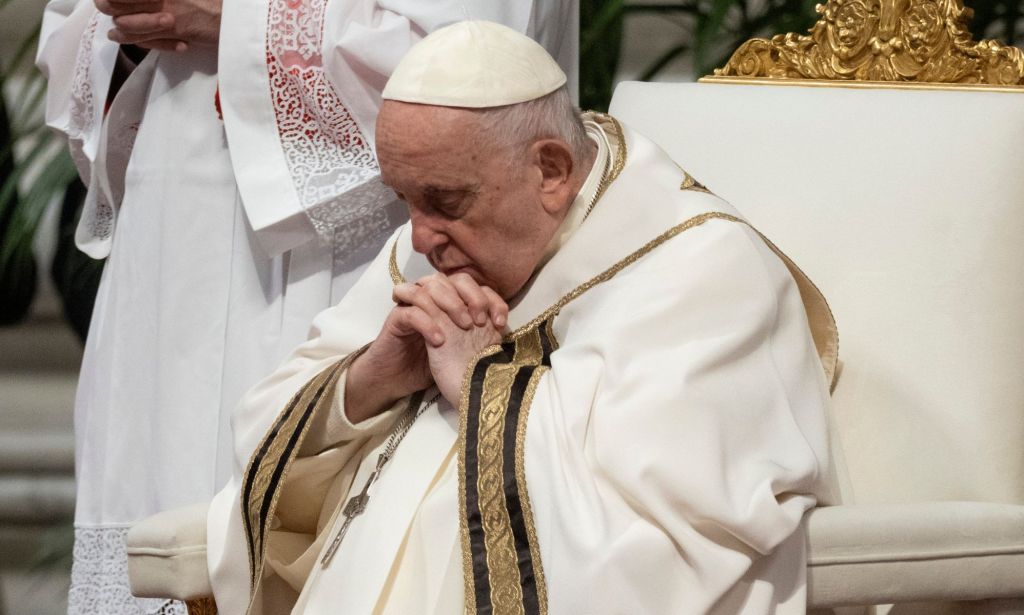 Pope Francis praying.