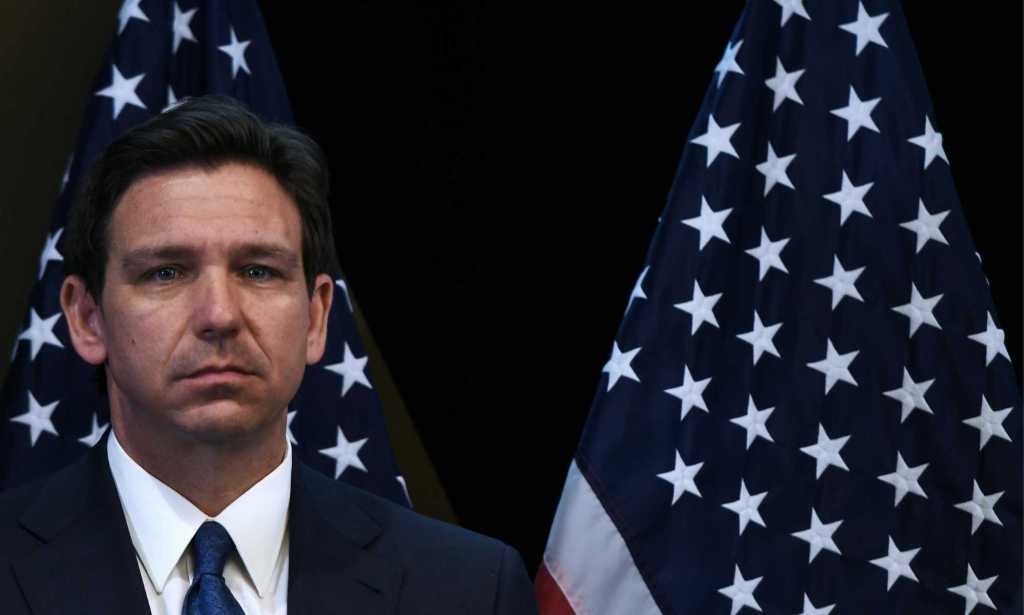 Ron DeSantis in front of United States flags
