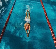 Stock image of person swimming in indoor lanes to illustrate Swim England story