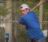 Seth Weathers hits a can of Bud Light with a baseball bat as part of an advert for Ultra Right Beer
