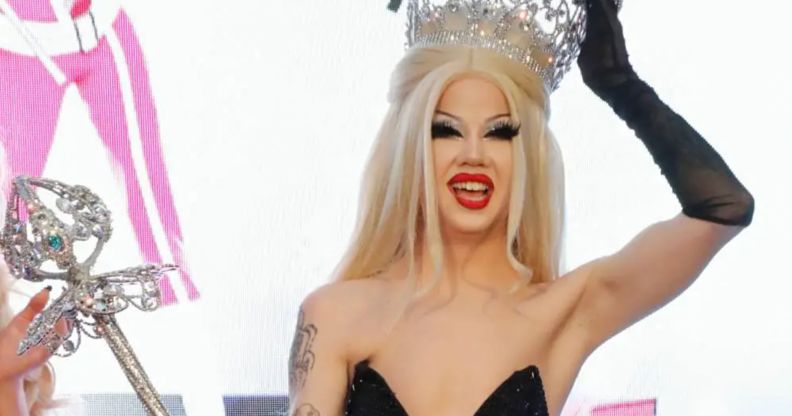 Drag Race seasonn 14 winner Willow Pill with her crown and sceptre.