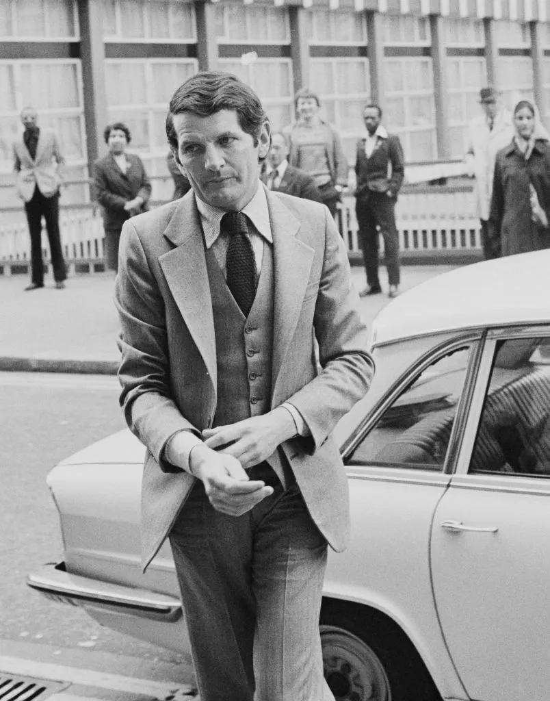 Norman Scott makes his way to court at the Old Bailey in London.