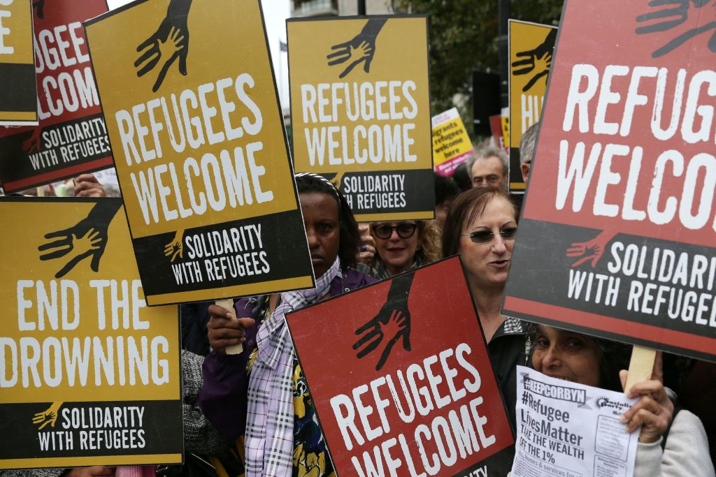 Demonstrators gather for a march calling for the British parliament to welcome refugees in the UK.
