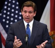 Ron DeSantis speaking in front of a US flag