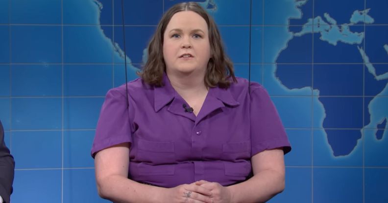 Saturday Night Live (SNL) cast member Molly Kearney wears a purple jumpsuit as they appear on the "Weekend Update" segment to talk about trans rights amid legislative efforts to ban access to gender-affirming healthcare for trans kids