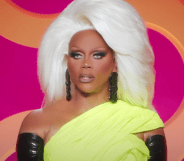A screenshot of RuPaul watching the runway from the judging panel in an episode of RuPaul's Drag Race All Stars 8