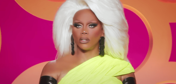 A screenshot of RuPaul watching the runway from the judging panel in an episode of RuPaul's Drag Race All Stars 8