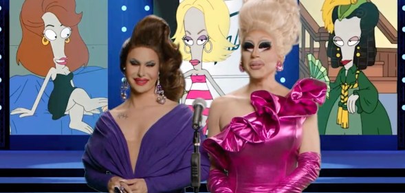 Drag queens Trixie Mattel and Trinity the Tuck stand in front of a backdrop featuring the character Roger from American Dad
