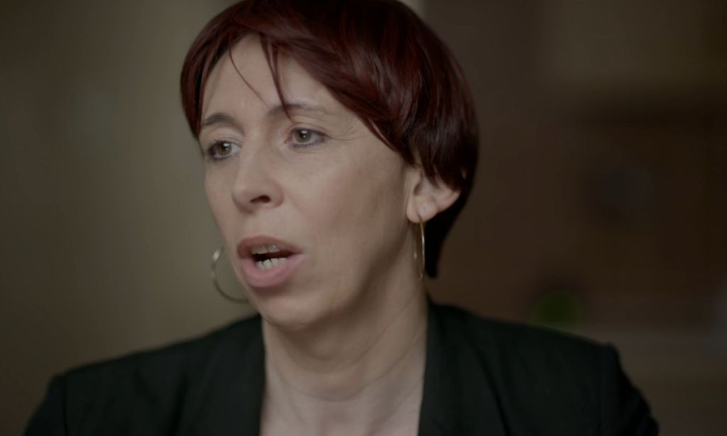 A still image of Dr Gina Gwenffrewi wearing dark clothing as she's interviewed for Channel 4's documentary Gender Wars