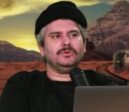 H3 Podcast host Ethan Klein infront of a green screen.