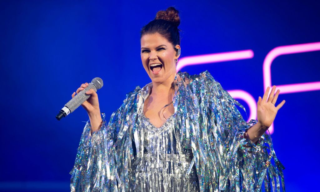 Saara Aalto performs in a silver fringe outfit.