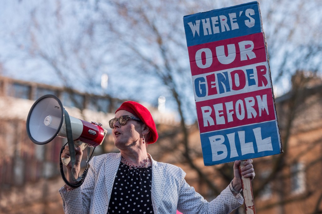 A trans rights activist addresses a protest opposite Downing Street in January 2023. (Mark Kerrison/Getty)