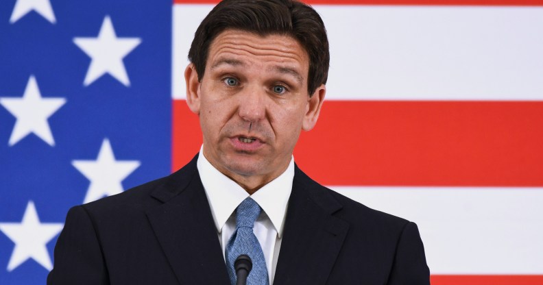 Florida Governor Ron DeSantis pictured with a background of the American flag