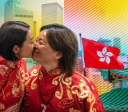 Two women kiss in front of a Hong Kong flag
