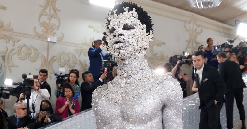 Lil Nas X in silver body paint at the Met Gala.