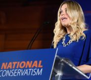 Miriam Cates, in a blue dress, speaking at the National Conservatism conference.