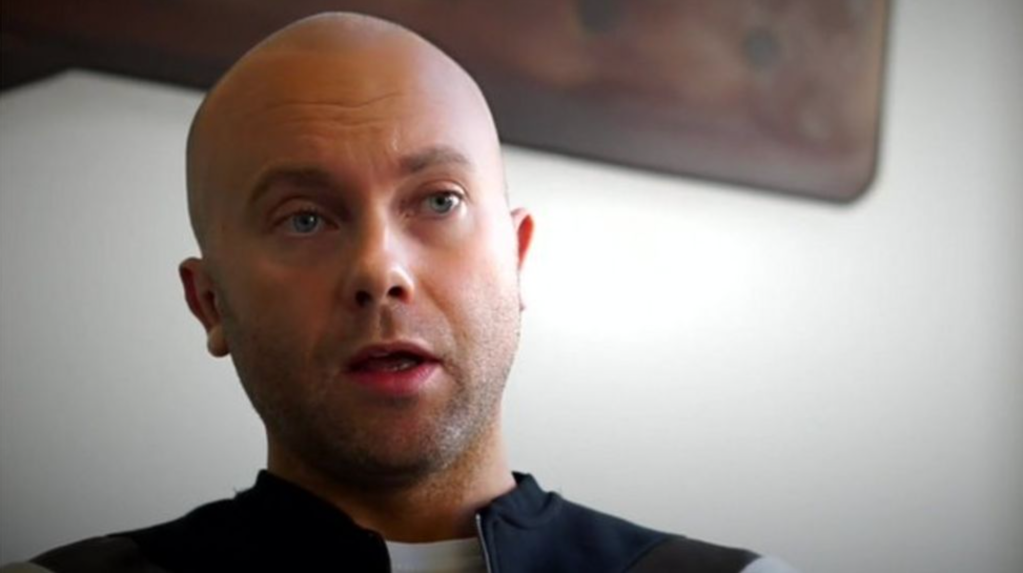 Patrick Strudwick in a black shirt, in a still taken from a BBC investigation into conversion therapy.