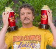 Pedro Pascal holds up two popcorn-shaped awards for the MTV Movie and TV Awards