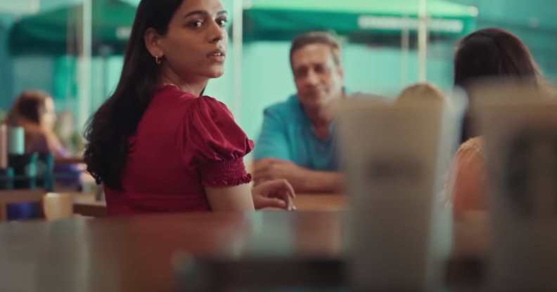 Screenshot from Starbucks ad showing Arpita looking at coffees