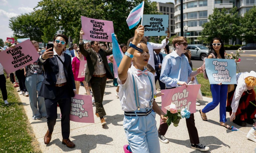 Members of the Washington Trans Youth Prom march together in protest of anti-LGBTQ+ legislation.
