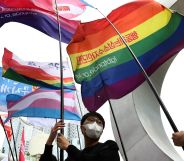 People in South Korea hold up a variety of LGBTQ+ flags in a protest against hatred towards the LGBTQ+ community on International Day Against Homophobia, Transphobia and Biphobia
