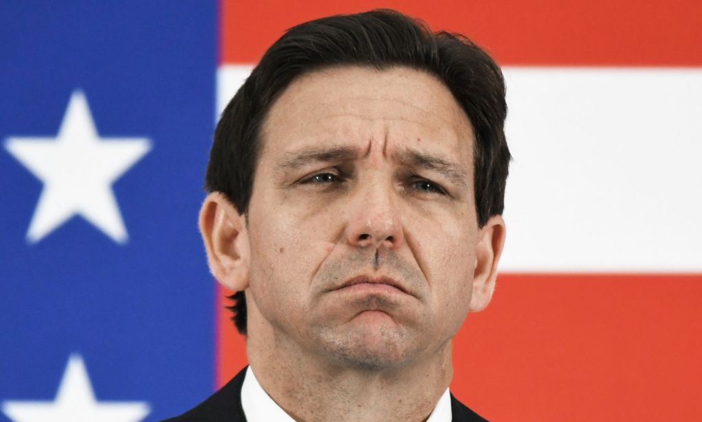 Republican governor Ron DeSantis, who has launched his 2024 presidential campaign, stands in front of an American flag