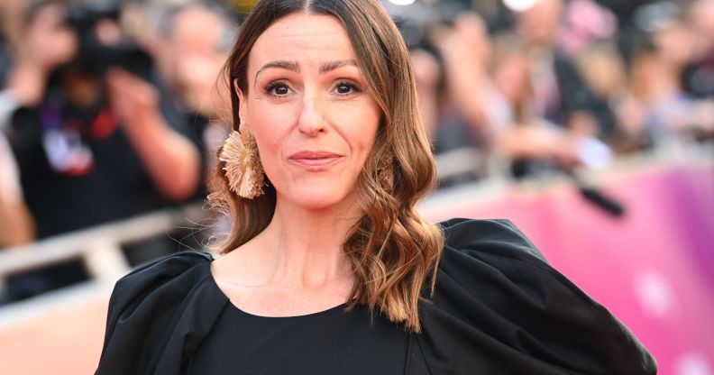 Gentleman Jack star Suranne Jones wears a black dress as she stands outside for an event