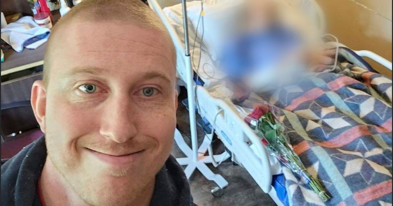 A picture of Bubba Pollock standing in front of a hospitalised man, blurred out