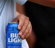 Man holds a Bud Light can