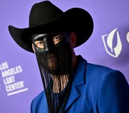 Gay country musician Orville Peck postpones tour citing mental and physical health reasons.