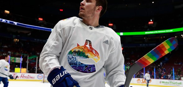 NHL player Bo Horvat of the Vancouver Canucks wears Pride jersey during warm-up in March 2022