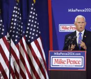 Former vice president Mike Pence stands at a podium reading "Mike Pence 2024" as he launches his presidential bid