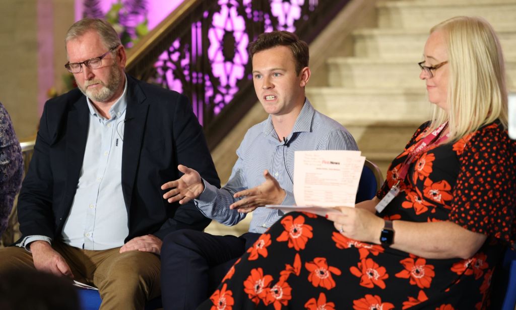 Alliance MLA Eóin Tennyson pictured in the centre with UUP leader Doug Beattie on his left and Karen McShane, trustee at the Rainbow Project, on his right. 