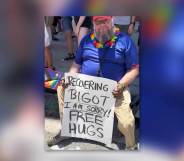 Man holds 'recovering bigot' sign at Denver Pride