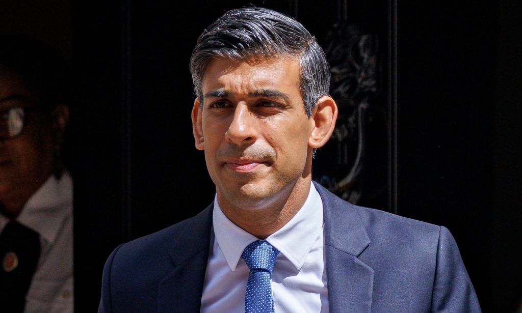 Rishi Sunak walking out the door of Number 10.