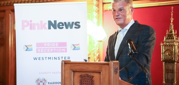 Equalities minister Stuart Andrew speaking at the PinkNews Westminster Pride Reception