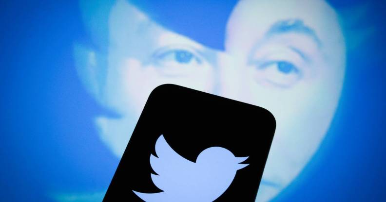 An effigy of Elon Musk is seen with a Twitter logo on a mobile device in this photo illustration.