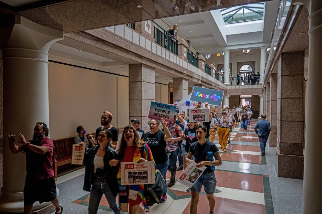 LGBTQ+ and trans rights advocates protest in the Texas Capitol Building against the wave of anti-LGBTQ+ bills in the state including a gender-affirming healthcare ban for trans youth