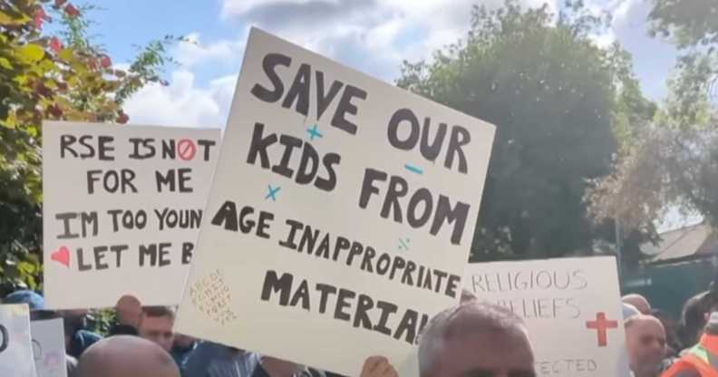 Parents hold signs up at Birchfields Primary School protest in Manchester