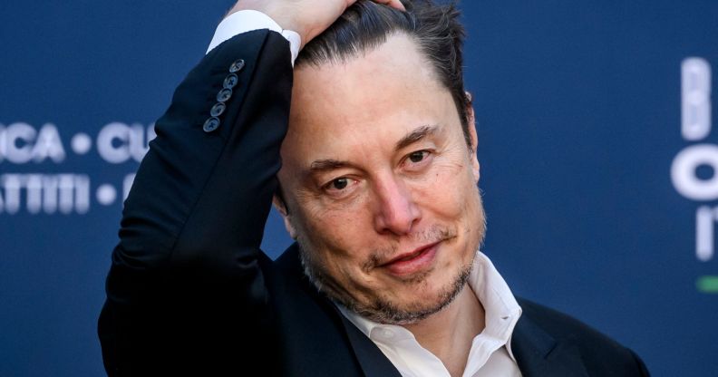 Elon Musk slicking his hair back.
