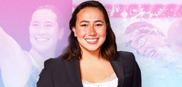 Erica Sullivan wearing a black suit and white t-shirt