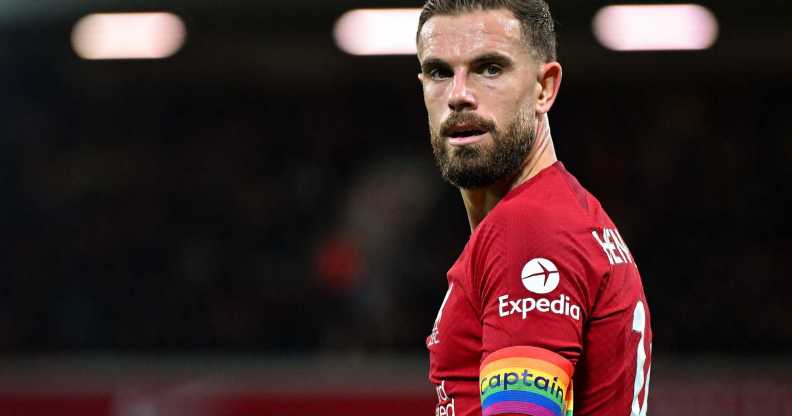 Liverpool player Jordan Henderson wearing a rainbow captain armband