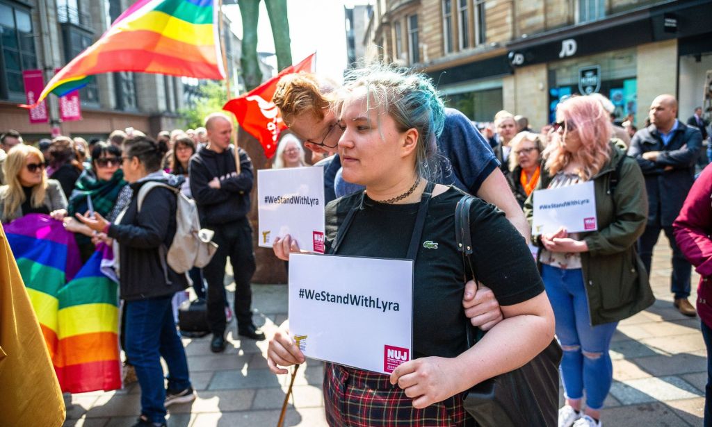 People attend a vigil for Lyra McKee in Scotland.