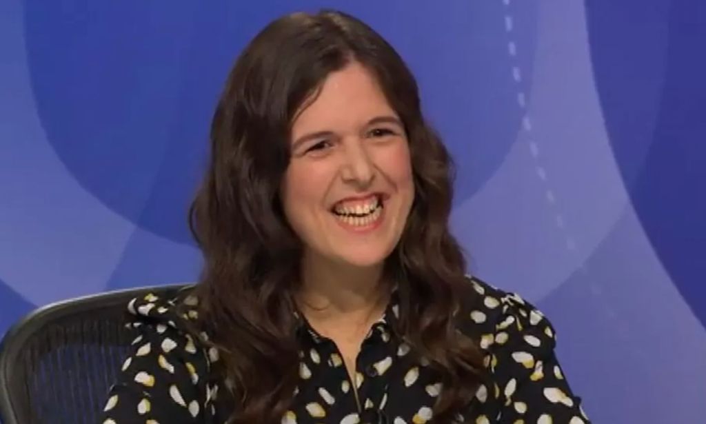 Rosie Jones smiles while appearing on the BBC Question Time panel.